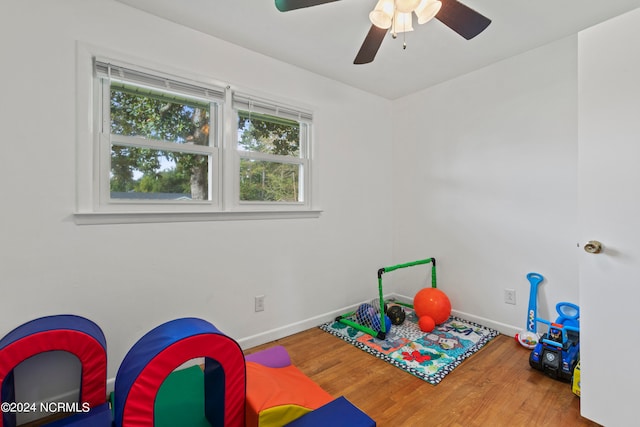 rec room with ceiling fan and hardwood / wood-style flooring