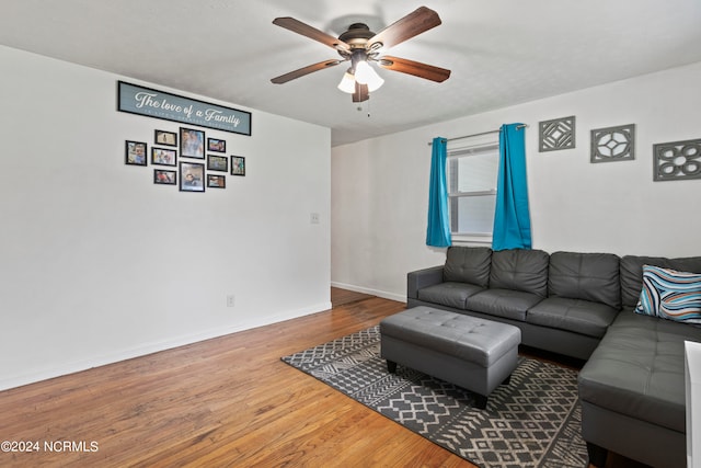 living room with hardwood / wood-style floors and ceiling fan