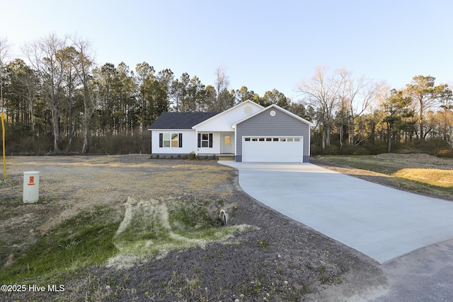 view of front of home with a garage and driveway