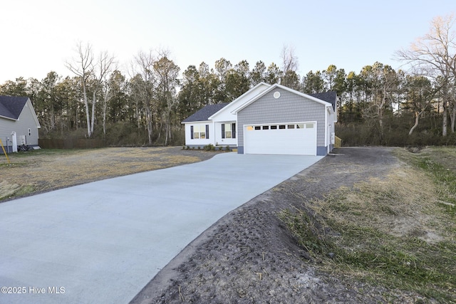 view of front of home with a garage and driveway