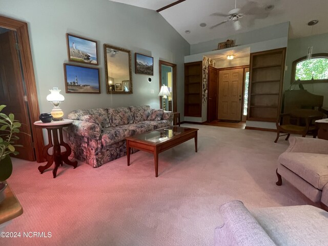 carpeted living room featuring lofted ceiling and ceiling fan