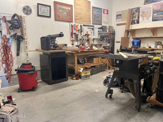 office space featuring a workshop area and concrete flooring