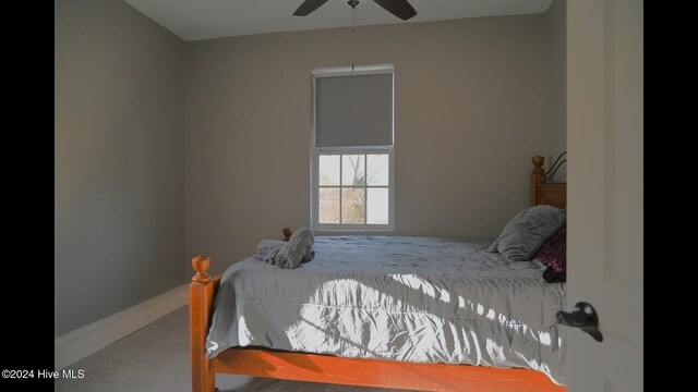 bedroom with ceiling fan and carpet floors