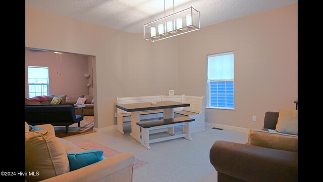 living room with light carpet and a textured ceiling