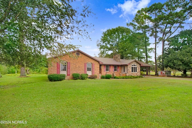 single story home featuring a front lawn