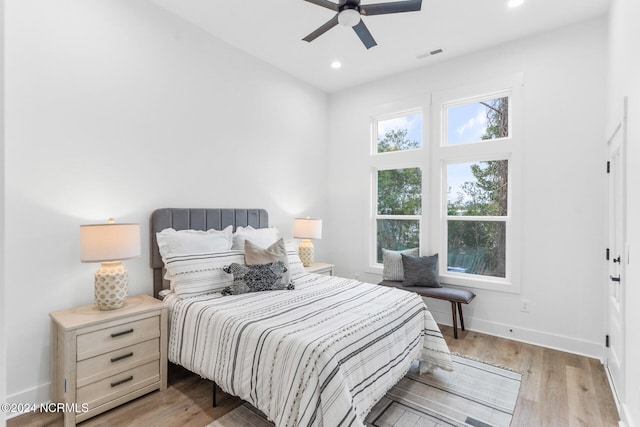 bedroom featuring light hardwood / wood-style floors and ceiling fan