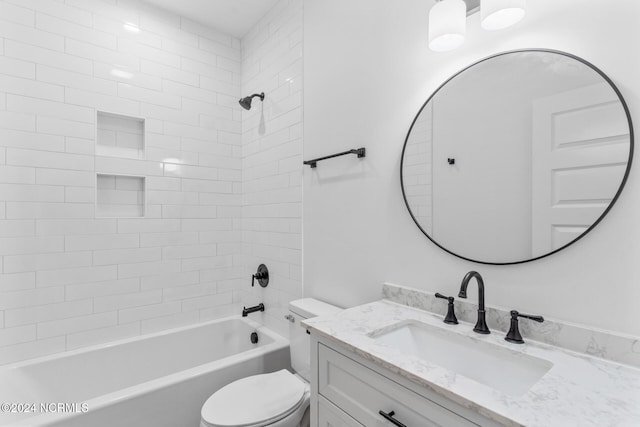 full bathroom with toilet, tiled shower / bath combo, and vanity