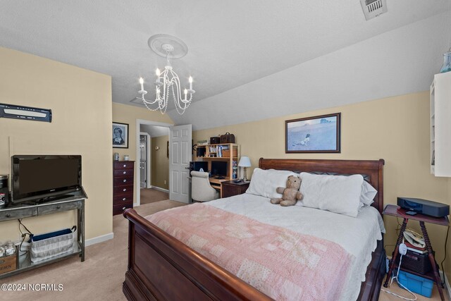 carpeted bedroom featuring lofted ceiling and a chandelier