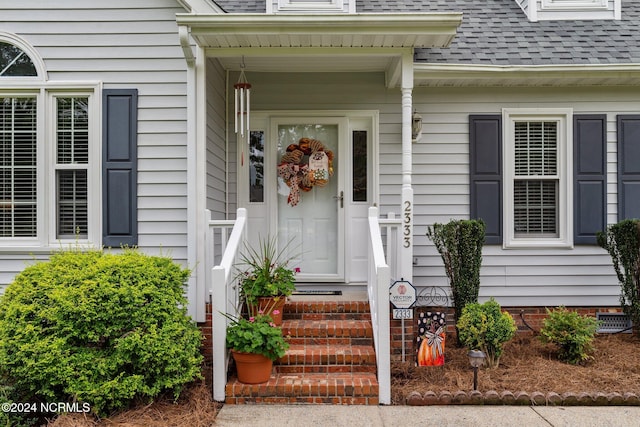 doorway to property featuring covered porch