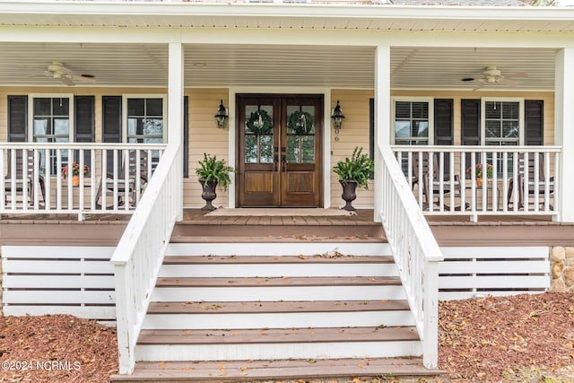 property entrance with ceiling fan and a porch