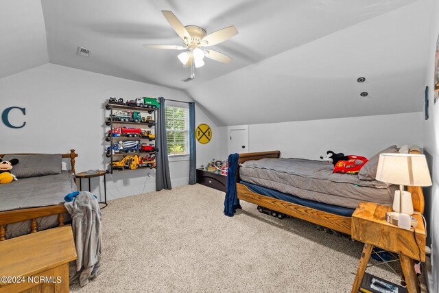 306 4th St, Pollocksville, NC 28573 - carpeted bedroom featuring vaulted ceiling, visible vents, and a ceiling fan