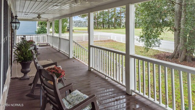 306 4th St, Pollocksville, NC 28573 - wooden deck with covered porch, ceiling fan, fence, and a yard