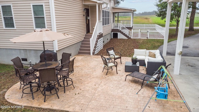 306 4th St, Pollocksville, NC 28573 - view of patio / terrace featuring an outdoor living space, a sunroom, fence, and outdoor dining area