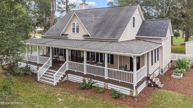 306 4th St, Pollocksville, NC 28573 - farmhouse inspired home featuring covered porch, a shingled roof, fence, and a chimney