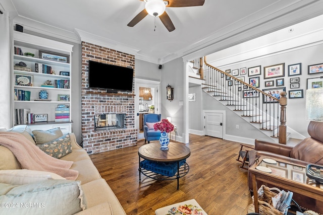 306 4th St, Pollocksville, NC 28573 - living room with crown molding, wood finished floors, ceiling fan, and stairway