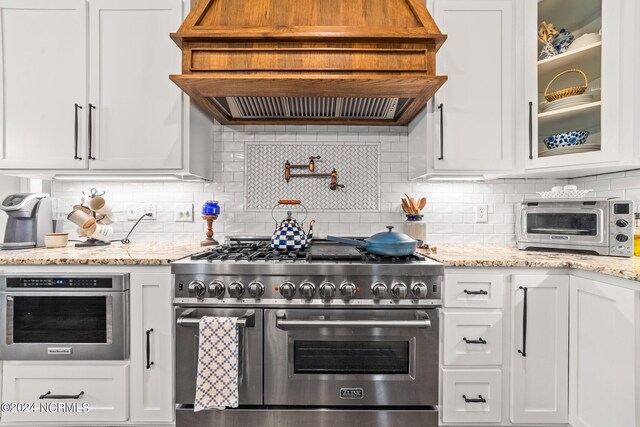 306 4th St, Pollocksville, NC 28573 - kitchen with white cabinetry and stainless steel appliances