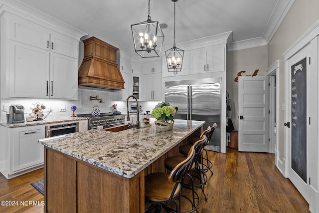306 4th St, Pollocksville, NC 28573 - kitchen with dark wood-style flooring, ornamental molding, a sink, a notable chandelier, and premium appliances