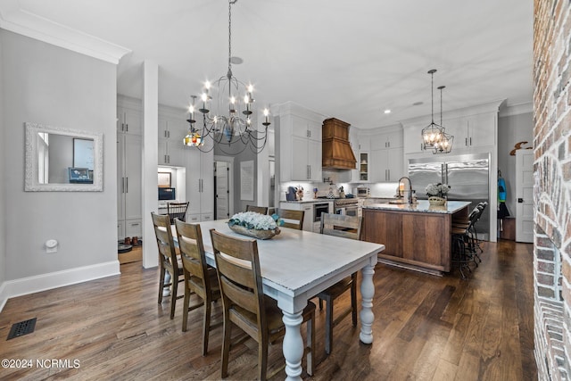 306 4th St, Pollocksville, NC 28573 - dining area featuring dark wood-style flooring, visible vents, baseboards, ornamental molding, and an inviting chandelier