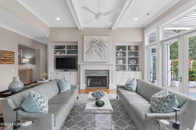 office area featuring lofted ceiling, wood finished floors, and crown molding