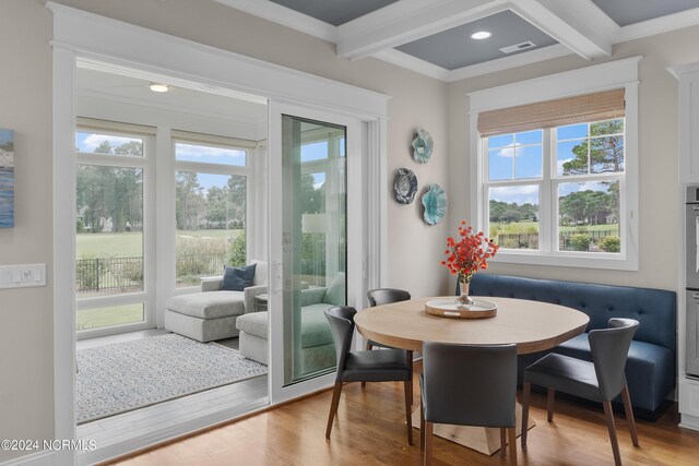 living area with recessed lighting, beam ceiling, coffered ceiling, and light wood-style flooring