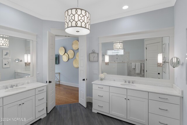 bedroom featuring visible vents, baseboards, a ceiling fan, beamed ceiling, and wood finished floors