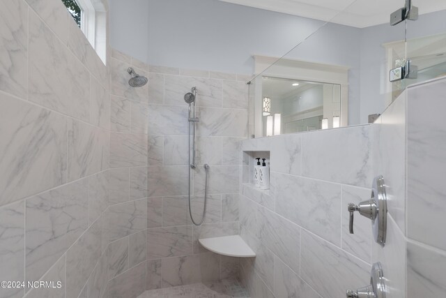 full bathroom with baseboards, two vanities, a sink, and wood finished floors