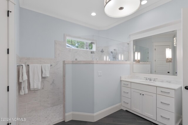 full bath featuring a walk in shower, crown molding, and wood finished floors