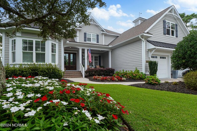 entrance to property featuring a yard