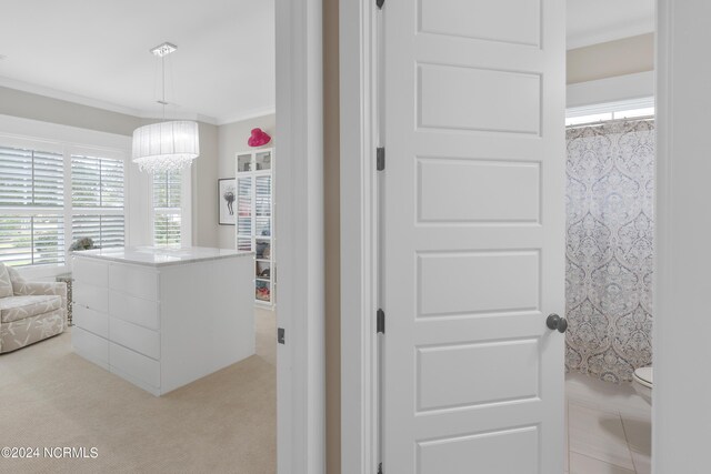 bathroom featuring baseboards, walk in shower, and vanity