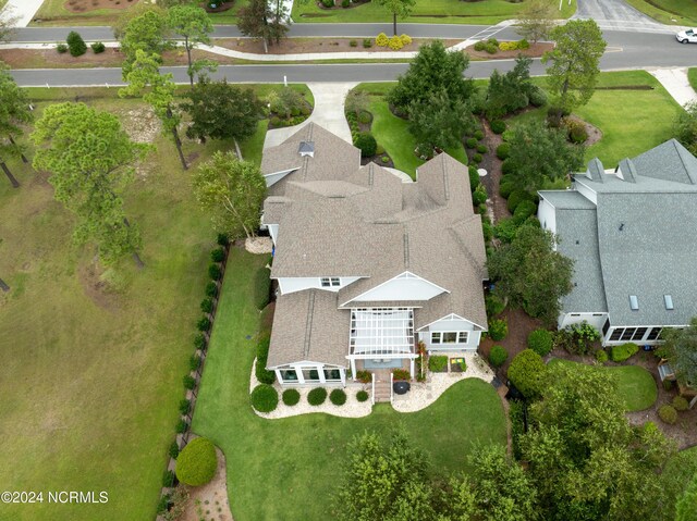 drone / aerial view featuring a residential view and golf course view