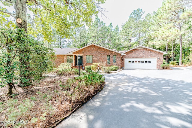 ranch-style house featuring a garage