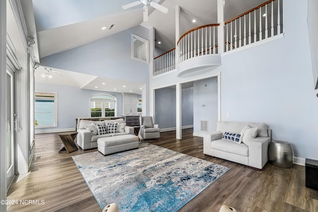 living room with high vaulted ceiling, wood-type flooring, and ceiling fan