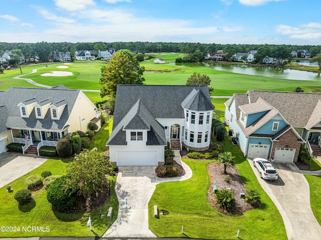 birds eye view of property with a water view