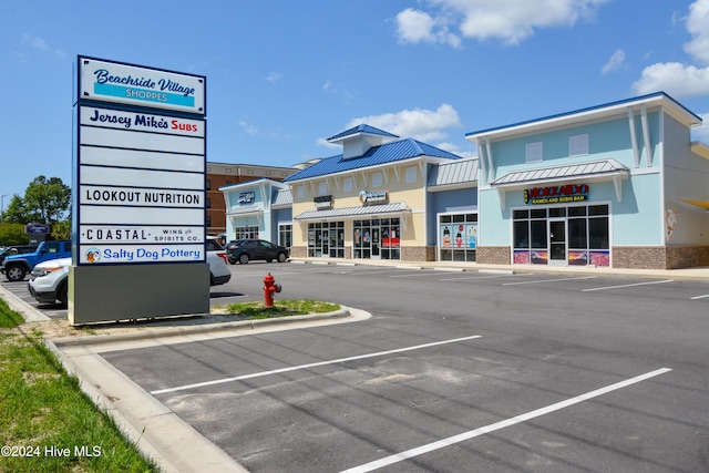 view of property with uncovered parking