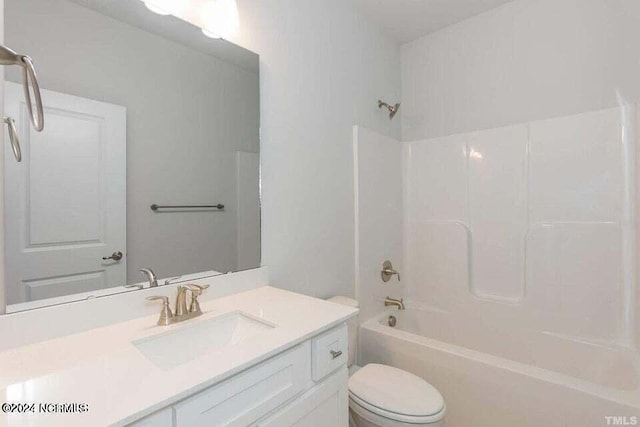 full bathroom with shower / tub combination, vanity, and toilet