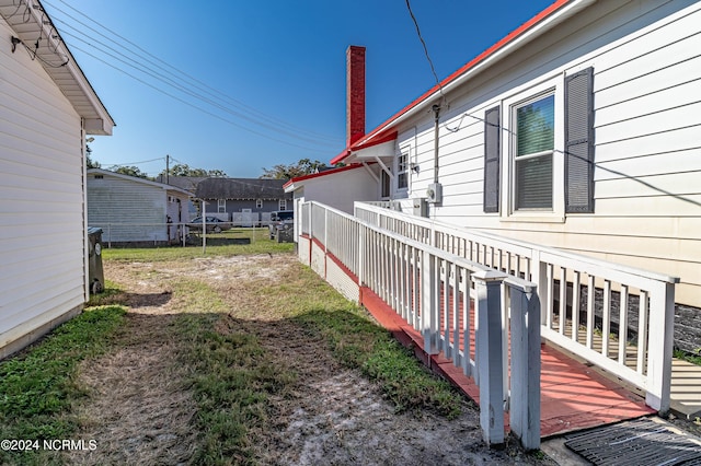 view of yard featuring a wooden deck