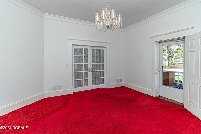 empty room featuring french doors, ornamental molding, and carpet