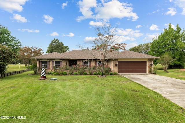 ranch-style home featuring a front yard and a garage