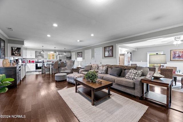 living room featuring ceiling fan, crown molding, and dark hardwood / wood-style flooring