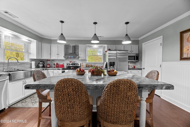 interior space with crown molding, sink, and dark wood-type flooring