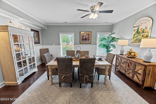 dining area with ornamental molding, ceiling fan, and dark hardwood / wood-style floors