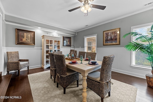 dining area featuring ceiling fan, dark hardwood / wood-style floors, and ornamental molding