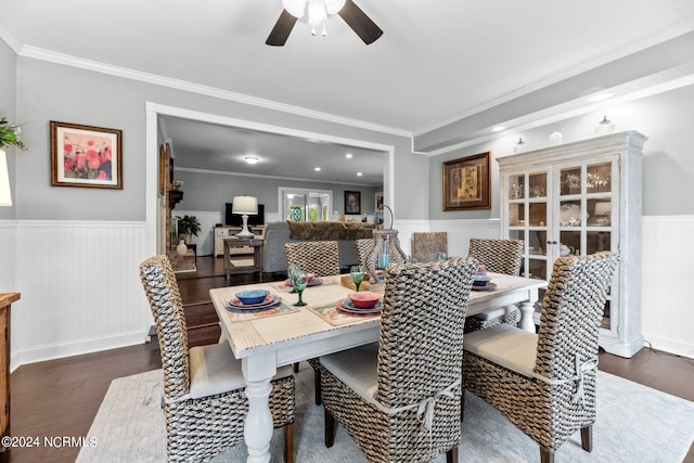 dining area featuring crown molding, dark hardwood / wood-style floors, and ceiling fan