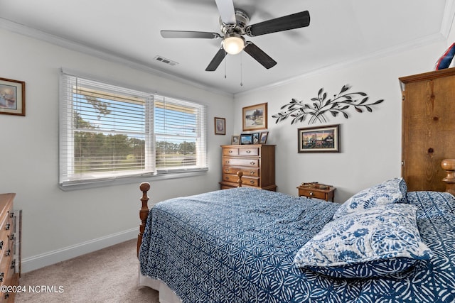 carpeted bedroom featuring crown molding and ceiling fan