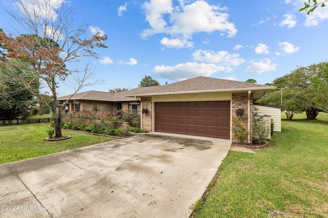 view of front of property featuring a garage and a front lawn