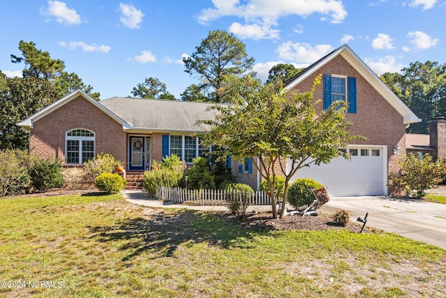 view of front of property with a garage and a front yard