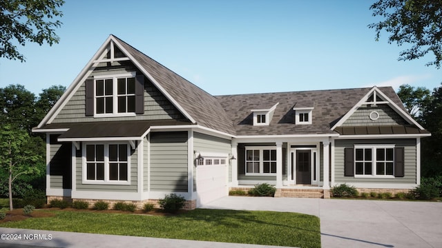 view of front of property with a garage and a front lawn