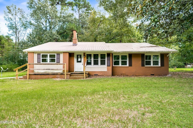 ranch-style house with a front yard