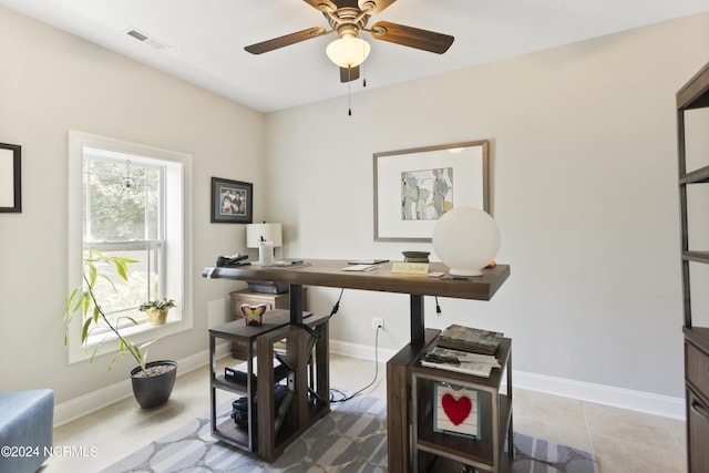 tiled office space with ceiling fan