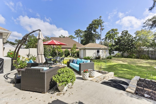 view of patio featuring an outdoor living space and an outdoor structure